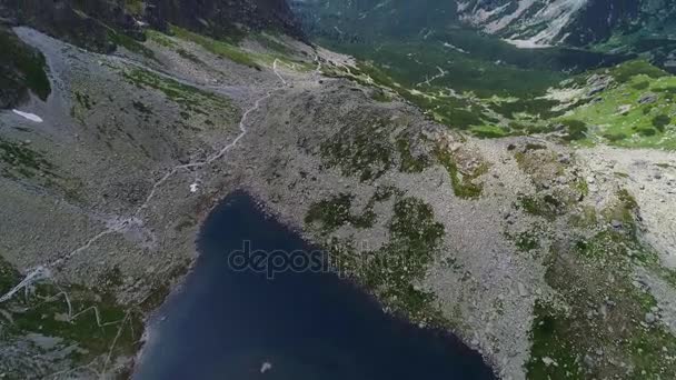 Aerial view of lake in mountains — Stock Video