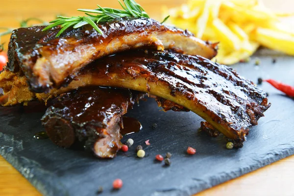 Fried potatoes and pork ribs — Stock Photo, Image