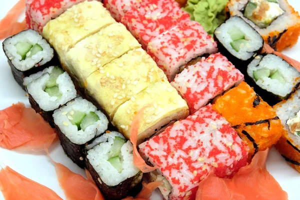 Sushi on white plate on white background closeup