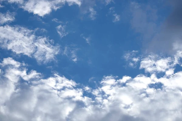 Beautiful landscape with white clouds on clear blue sky — Stock Photo, Image