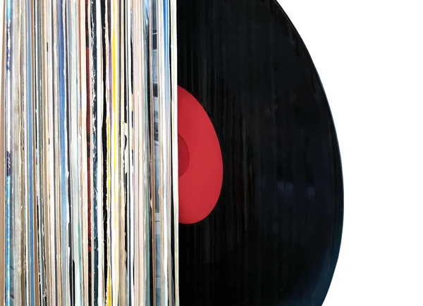 Vinyl record inserted to vertical pile isolated on white background side view — Stock Photo, Image