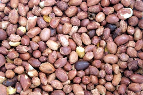 Viele geröstete Erdnussfrüchte als Hintergrundansicht — Stockfoto