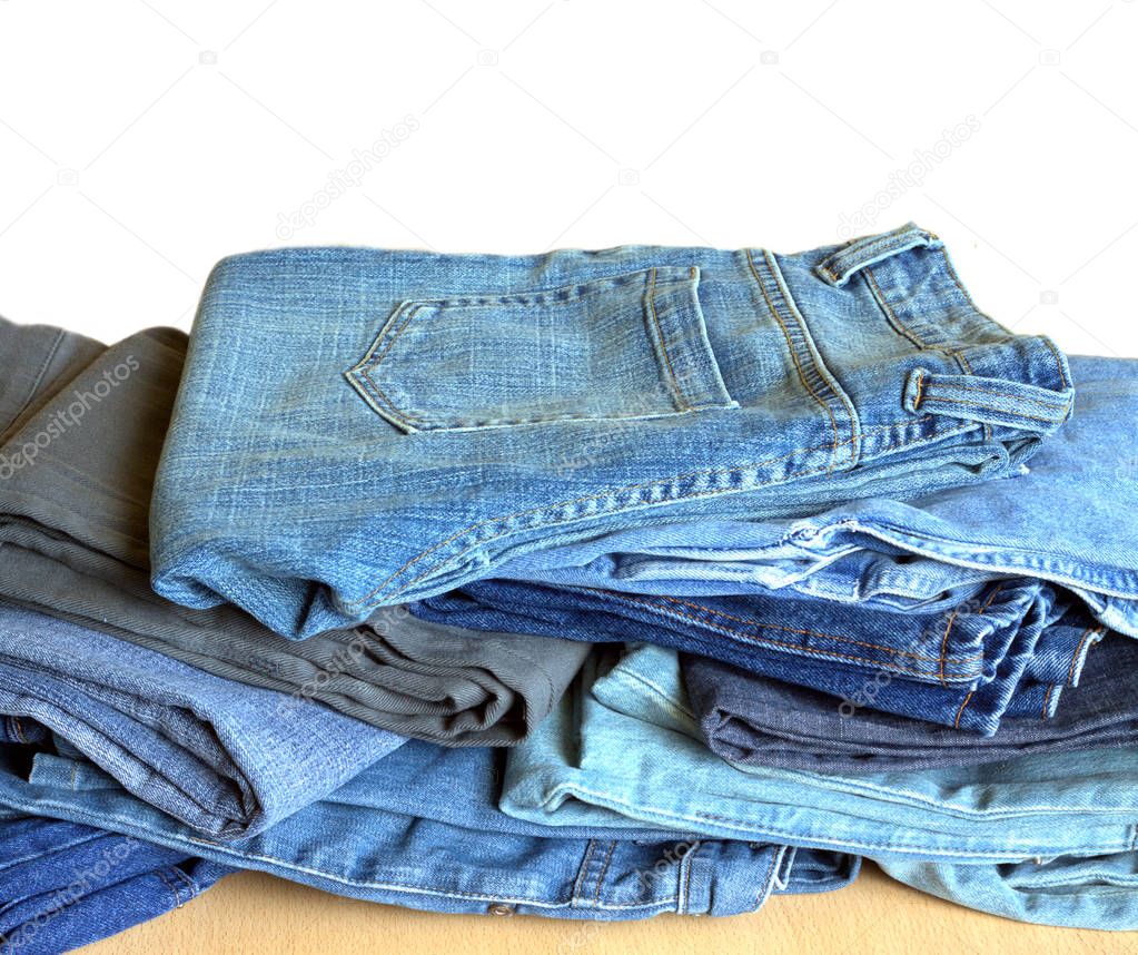 Heap of modern jeans on sale isolated close-up