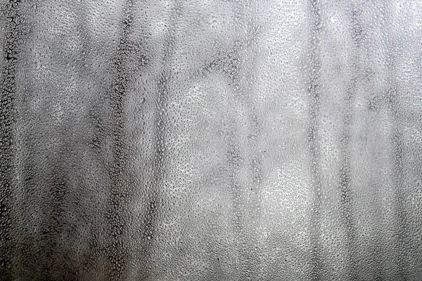 Rain drops on window glass on gloomy autumn day closeup — Stock Photo, Image