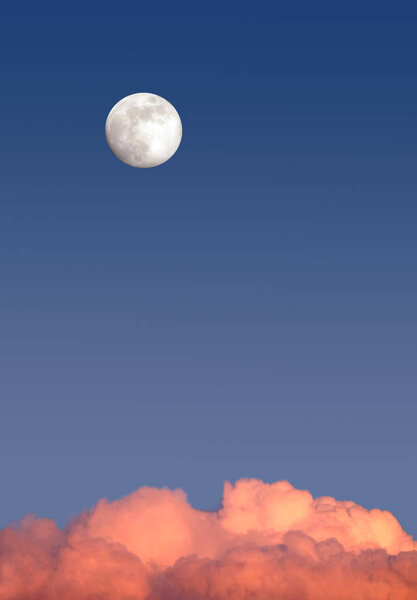 Beautiful sky landscape with white full moon high on clear blue gradient sky above red clouds on sunset vertica view