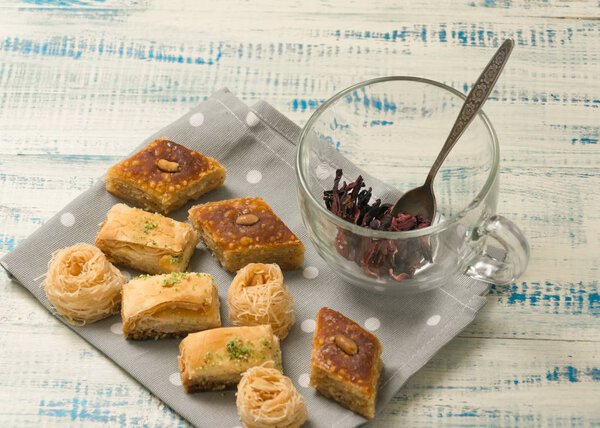 Oriental sweets on a wooden background.
