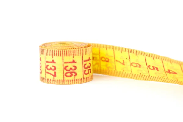Yellow flexible porn centimeter for measurements on a white background. — Stock Photo, Image