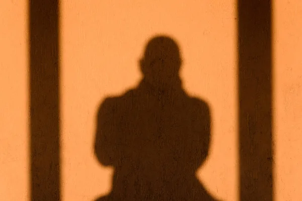 Shadow oShadow of a male figure.f a male figure.