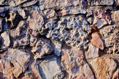 Eski bir taş duvarın arka planı.