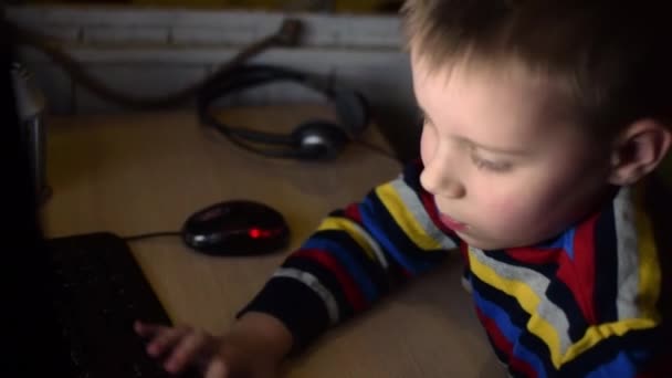 Little Boy Typing Keyboard Child Indulges Plays Computer Dark Room — Stock Video