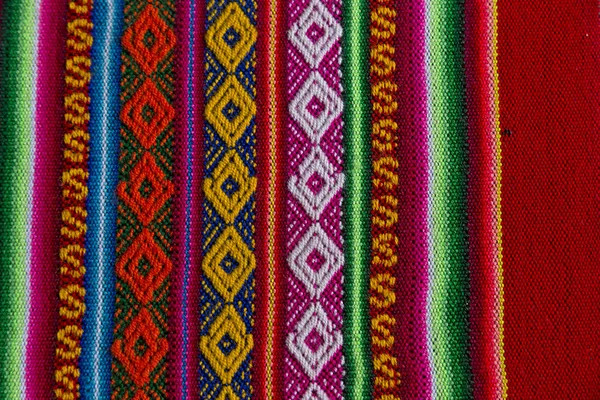 Andské textilu v vlny Alpaka a list — Stock fotografie