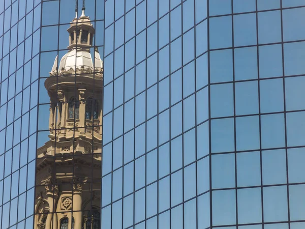 Reflection in a glass building of the Metropolitan Cathedral of Santiago. Chile — Stock Photo, Image