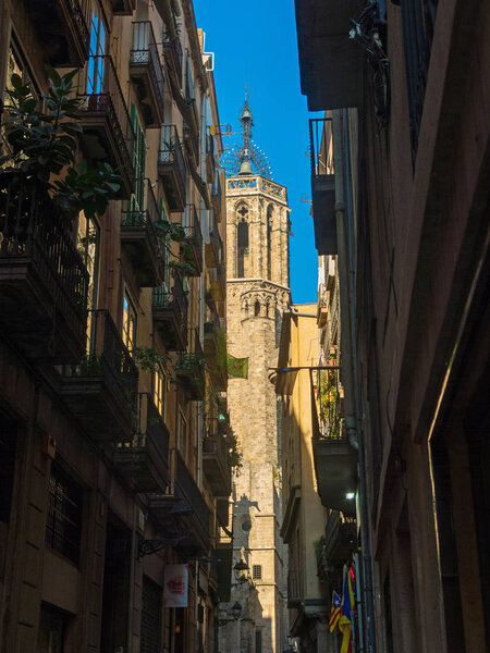 The belfry of the cathedral from the Gothic Quarter in Barcelona