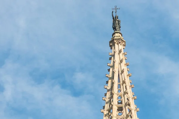 Statue of Saint Eulalia, patron saint of the city, on the spire — Stock Photo, Image