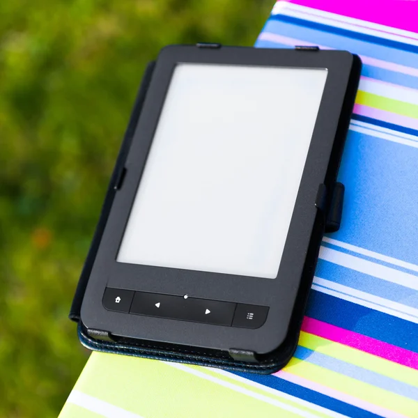 E-Book reader on the chair, closeup view — Stock Photo, Image