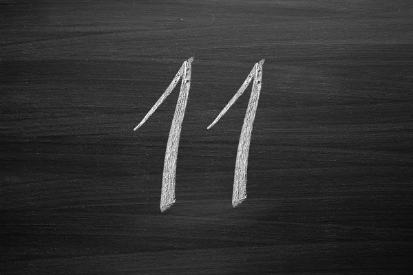 Number eleven enumeration written with a chalk on the blackboard — Stock Photo, Image