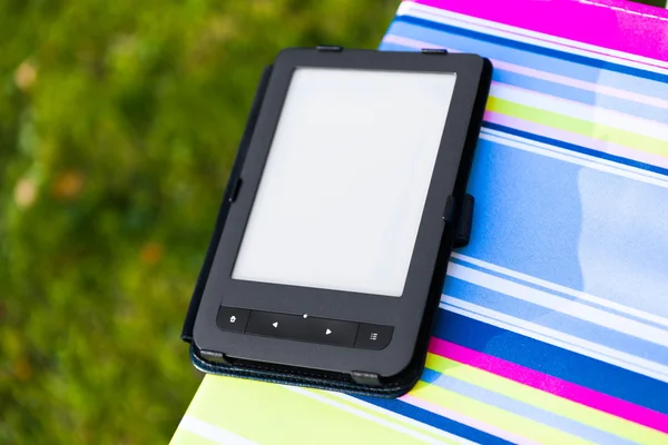 E-Book reader on the chair, closeup view — Stock Photo, Image