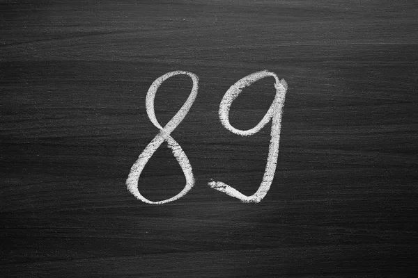 Number eighty nine enumeration written with a chalk on the blackboard — Stock Photo, Image