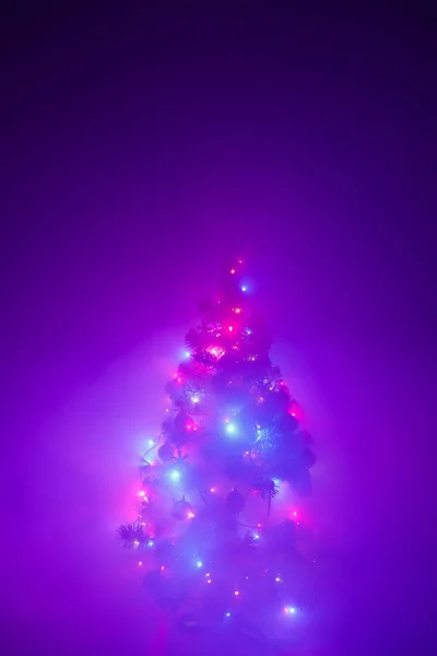 Christmas tree lights garland in frozen mist — Stock Photo, Image