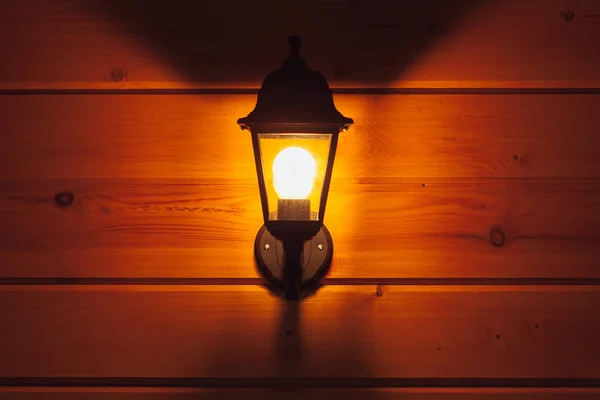 Exterior lantern on wooden house — Stock Photo, Image