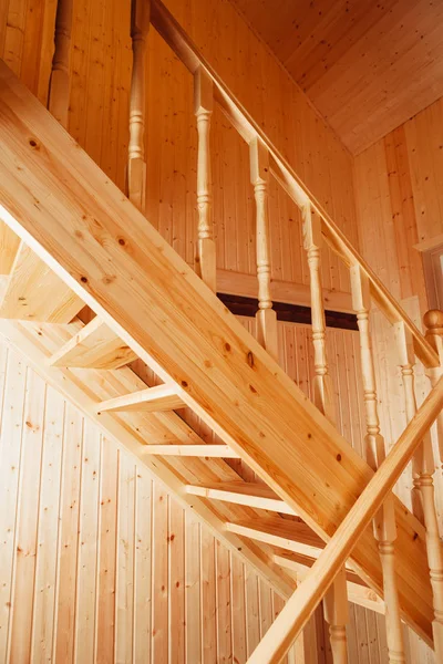 Staircase and banisters inside of wooden house Stock Picture