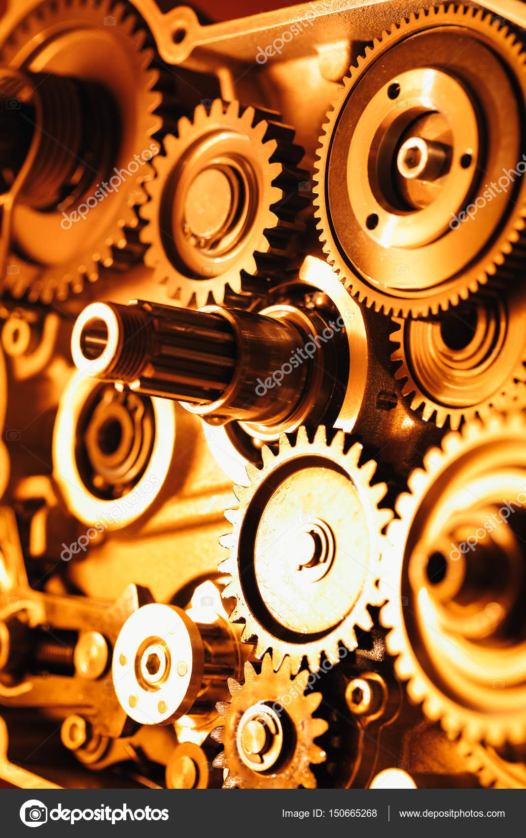 Engine gear wheels, industrial background Stock Photo by ©nikkytok