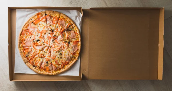 fresh pizza in a box
