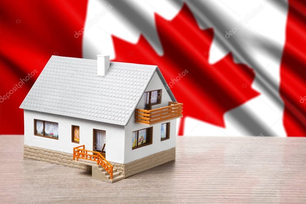 classic house against Canada flag background