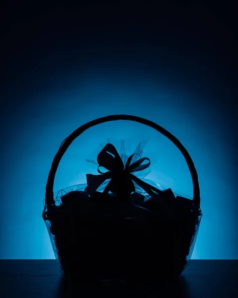 Gift basket silhouette on blue background — Stock Photo, Image