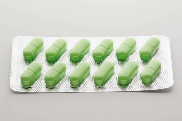 Blistr s zelené pilulky — Stock fotografie
