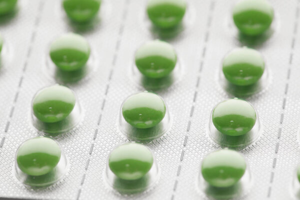 пузырь пакет с зелеными таблетками

