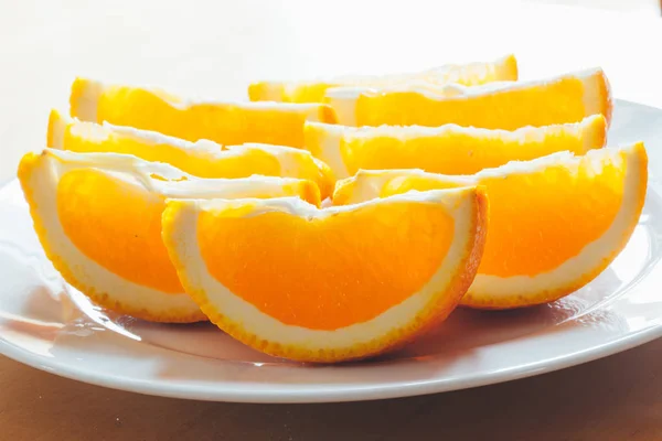 Fresh orange slices on a plate — Stock Photo, Image