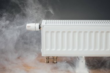 heating radiator with warm steam clipart