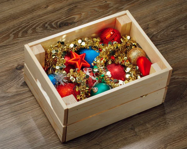 Christmas decorations stored in wooden box