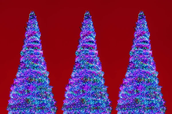 Alberi di Natale led luci, sfondo rosso — Foto Stock