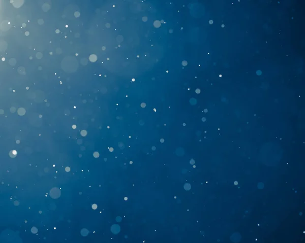 Blaues Licht Hintergrund mit Schneeflocken Teilchen — Stockfoto