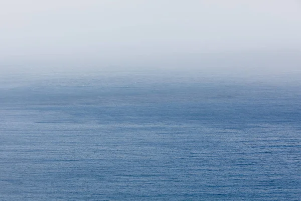 Blue sea and mist backdrop — Stock Photo, Image