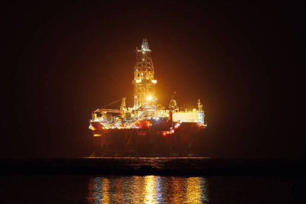 offshore oil platform at night