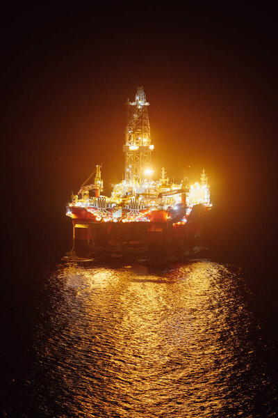 offshore oil platform at night