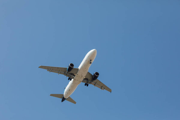 flying airplane in blue sky