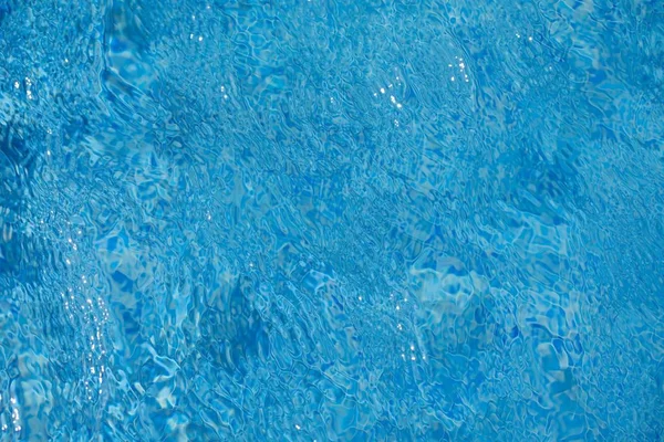 Vatten ripples textur i poolen — Stockfoto