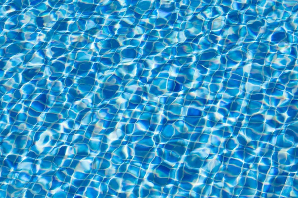 Water ripples texture in swimming pool — Stock Photo, Image