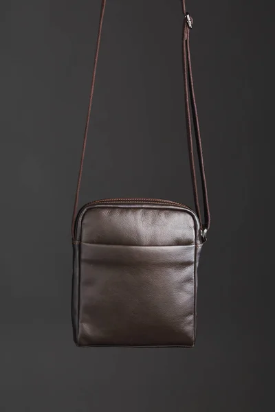 Male brown leather bag, gray background — ストック写真