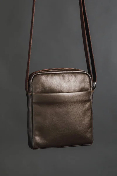 Male brown leather bag, gray background — ストック写真