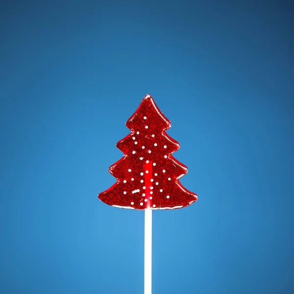Árbol de Navidad dulce caramelo, fondo azul — Foto de Stock