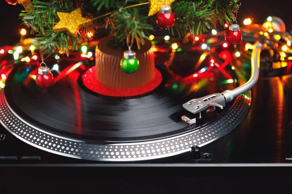 Christmas tree and festive turntable with colorful led lights — Stock Photo, Image