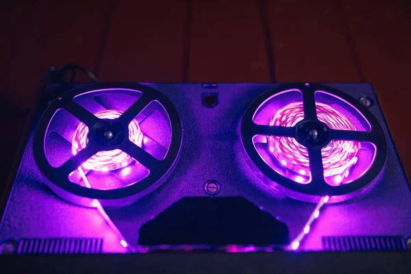 reel to reel audio tape recorder with purple led light strip