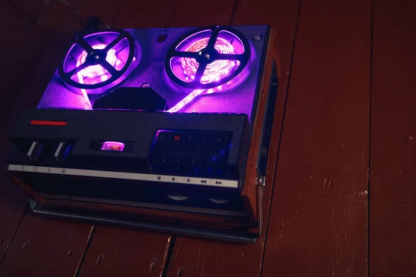 reel to reel audio tape recorder with purple led light strip