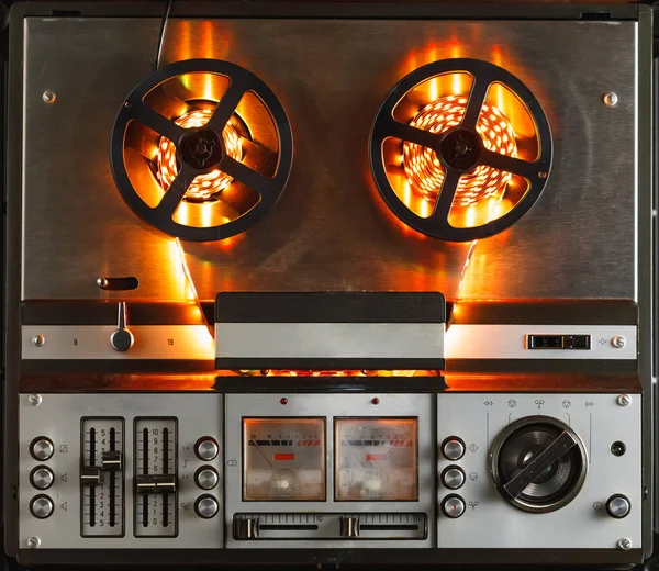 reel to reel audio tape recorder with orange led light strip