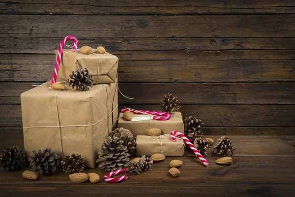 Christmas gifts and candy canes — Stock Photo, Image